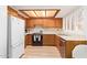 Eat-in kitchen showcases wood cabinets, tile countertops, and stainless steel dishwasher at 459 S Boojum Way, Mesa, AZ 85208