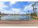 Lake with a fountain surrounded by palm trees showcasing a serene community setting at 459 S Boojum Way, Mesa, AZ 85208
