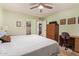 Bright main bedroom showcases wood-look flooring, closet, and work desk at 459 S Boojum Way, Mesa, AZ 85208