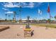 Solemn statue in a memorial park setting, with flags and palm trees at 459 S Boojum Way, Mesa, AZ 85208
