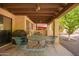 Relaxing covered patio area perfect for outdoor dining and entertaining with a grill and garden view at 459 S Boojum Way, Mesa, AZ 85208