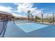Outdoor pickleball court with blue surface, enclosed by a black chainlink fence at 459 S Boojum Way, Mesa, AZ 85208