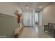 Home foyer featuring tile flooring, a bench, coat rack and a view of the front door at 4878 W Elijah Ln, San Tan Valley, AZ 85144