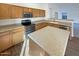 Kitchen with updated countertops, cabinetry, and modern stainless-steel appliances at 517 S 125Th Ave, Avondale, AZ 85323