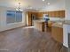 Well-equipped kitchen featuring an island, wood cabinets, and stainless steel appliances at 517 S 125Th Ave, Avondale, AZ 85323
