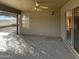 Spacious covered patio featuring brick flooring and a ceiling fan, creating a relaxing outdoor space at 517 S 125Th Ave, Avondale, AZ 85323