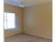 Bedroom with neutral carpeting, light walls, and a large window for natural light at 5335 E Shea Blvd # 1095, Scottsdale, AZ 85254