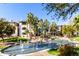 Beautiful lake with fountains surrounded by lush landscaping and palm trees in the Riverwalk community at 5345 E Van Buren St # 167, Phoenix, AZ 85008
