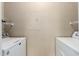 Functional laundry room with modern machines and shelving, for all your laundry needs at 5345 E Van Buren St # 167, Phoenix, AZ 85008