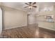 Spacious living room with wood floors, ceiling fan, and an open layout at 5345 E Van Buren St # 167, Phoenix, AZ 85008