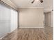 Bright living room with wood floors, ceiling fan, and sliding glass doors at 5345 E Van Buren St # 167, Phoenix, AZ 85008