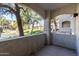 Covered patio offers scenic views of the landscaped community with a pond at 5345 E Van Buren St # 167, Phoenix, AZ 85008