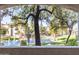 Scenic view of the community pond, fountain, and lush landscaping at 5345 E Van Buren St # 167, Phoenix, AZ 85008