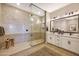 Modern bathroom showcasing a glass-enclosed shower, double vanity with sleek fixtures, and contemporary design at 5719 S Quartz St, Gilbert, AZ 85298