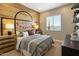 A basketball-themed bedroom showcases a wooden accent wall with a hoop design at 5719 S Quartz St, Gilbert, AZ 85298
