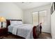 Cozy bedroom featuring a comfortable sleigh bed and natural light from a window at 6965 E Hacienda La Noria Ln, Gold Canyon, AZ 85118