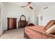 Carpeted bedroom has dark wood furniture and neutral tones with a large closet entrance at 6965 E Hacienda La Noria Ln, Gold Canyon, AZ 85118