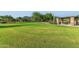 Lush green community park features covered picnic areas, desert landscaping, and mountain views at 6965 E Hacienda La Noria Ln, Gold Canyon, AZ 85118