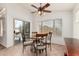 Cozy dining area with a ceiling fan, sliding glass doors to the patio, and a round table with four chairs at 6965 E Hacienda La Noria Ln, Gold Canyon, AZ 85118