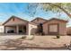 Attractive single-story home with an open garage and inviting desert landscape at 6965 E Hacienda La Noria Ln, Gold Canyon, AZ 85118