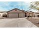 Inviting single-story home featuring a spacious driveway and a two-car garage at 6965 E Hacienda La Noria Ln, Gold Canyon, AZ 85118