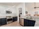 Well-lit kitchen featuring stainless steel appliances, granite countertops, and a breakfast bar with seating at 6965 E Hacienda La Noria Ln, Gold Canyon, AZ 85118
