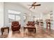 Bright and airy living room with high ceilings, large windows, and comfortable seating for relaxation and entertainment at 6965 E Hacienda La Noria Ln, Gold Canyon, AZ 85118