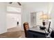 Bright office features white trim and ample sunlight with space for working from home at 6965 E Hacienda La Noria Ln, Gold Canyon, AZ 85118