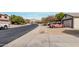 Neighborhood street view with mountain backdrop, sidewalks and desert landscaping at 6965 E Hacienda La Noria Ln, Gold Canyon, AZ 85118