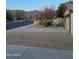 Desert landscaping and a view of the mountains complement this home on a quiet street at 6965 E Hacienda La Noria Ln, Gold Canyon, AZ 85118