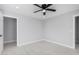 Inviting bedroom features neutral colors, a modern ceiling fan, and open doorways at 700 N D St, Eloy, AZ 85131