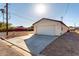 Long driveway with a two car garage at the end at 700 N D St, Eloy, AZ 85131
