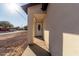 Home's front door features an oval window for natural lighting and classic charm at 700 N D St, Eloy, AZ 85131