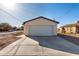 Exterior of home with a two car garage and large driveway at 700 N D St, Eloy, AZ 85131