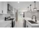Modern kitchen with white cabinets, stainless steel appliances, and a large center island at 700 N D St, Eloy, AZ 85131