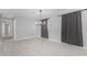 The living room features large windows with modern light fixtures and neutral paint at 700 N D St, Eloy, AZ 85131