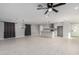 An open concept living space with lots of natural light, white flooring, and modern light fixtures at 700 N D St, Eloy, AZ 85131