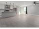 Bright and airy living room featuring neutral paint, tile floors, a modern ceiling fan, and a large window at 700 N D St, Eloy, AZ 85131