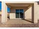 Covered patio featuring a sliding glass door and neutral color scheme at 700 N D St, Eloy, AZ 85131