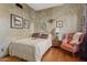 Bedroom featuring neutral colors, hardwood floors, and warm light at 9 W Glenhaven Dr, Phoenix, AZ 85045