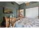 Bedroom showcasing log bed frame, and an earthy green paint at 9 W Glenhaven Dr, Phoenix, AZ 85045