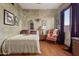 Bedroom featuring hardwood floors, neutral colors, and natural light at 9 W Glenhaven Dr, Phoenix, AZ 85045
