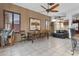 Dining area with tiled floors, a rustic table, and views to the backyard at 9 W Glenhaven Dr, Phoenix, AZ 85045