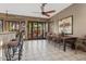 Large dining area with bar, tile floor, and French doors leading to the outdoors at 9 W Glenhaven Dr, Phoenix, AZ 85045