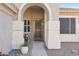 Inviting front entryway with decorative accents, a wreath, and desert landscaping at 9 W Glenhaven Dr, Phoenix, AZ 85045