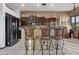 Kitchen with stainless steel appliances, tile backsplash, and bar stool seating at 9 W Glenhaven Dr, Phoenix, AZ 85045