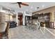 Open-concept kitchen with bar seating, stainless steel appliances, and tile flooring at 9 W Glenhaven Dr, Phoenix, AZ 85045