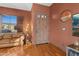 Cozy living room featuring warm-toned walls, wood floors, and natural lighting at 9 W Glenhaven Dr, Phoenix, AZ 85045