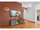 Contemporary living room featuring dark accent walls and wood floors at 9 W Glenhaven Dr, Phoenix, AZ 85045