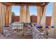 Covered outdoor kitchen with granite counters, grill, and bar seating at 9 W Glenhaven Dr, Phoenix, AZ 85045